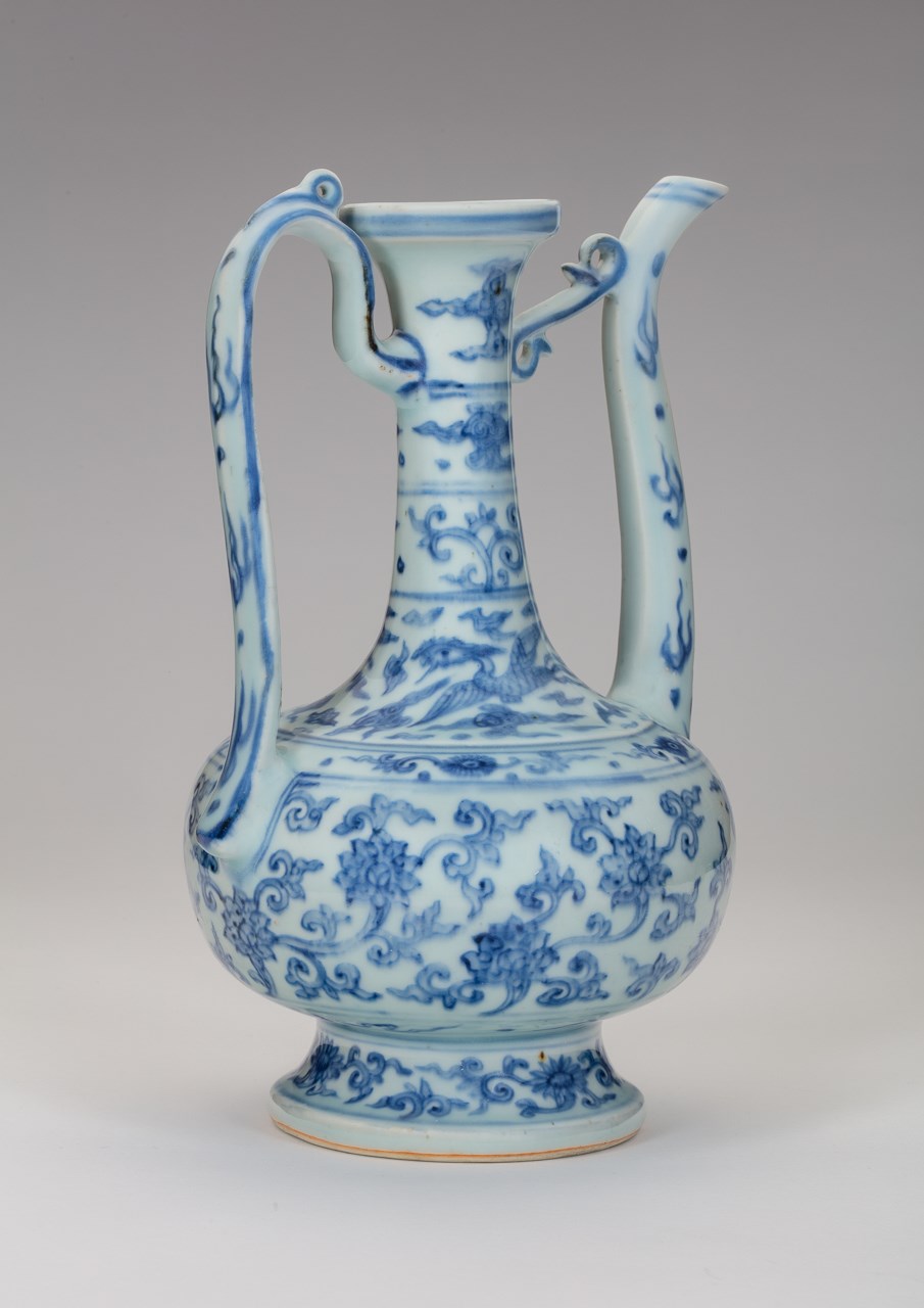 A MING BLUE-AND-WHITE EWER WITH XUANDE MARK 明宣德款青花缠枝莲纹执 